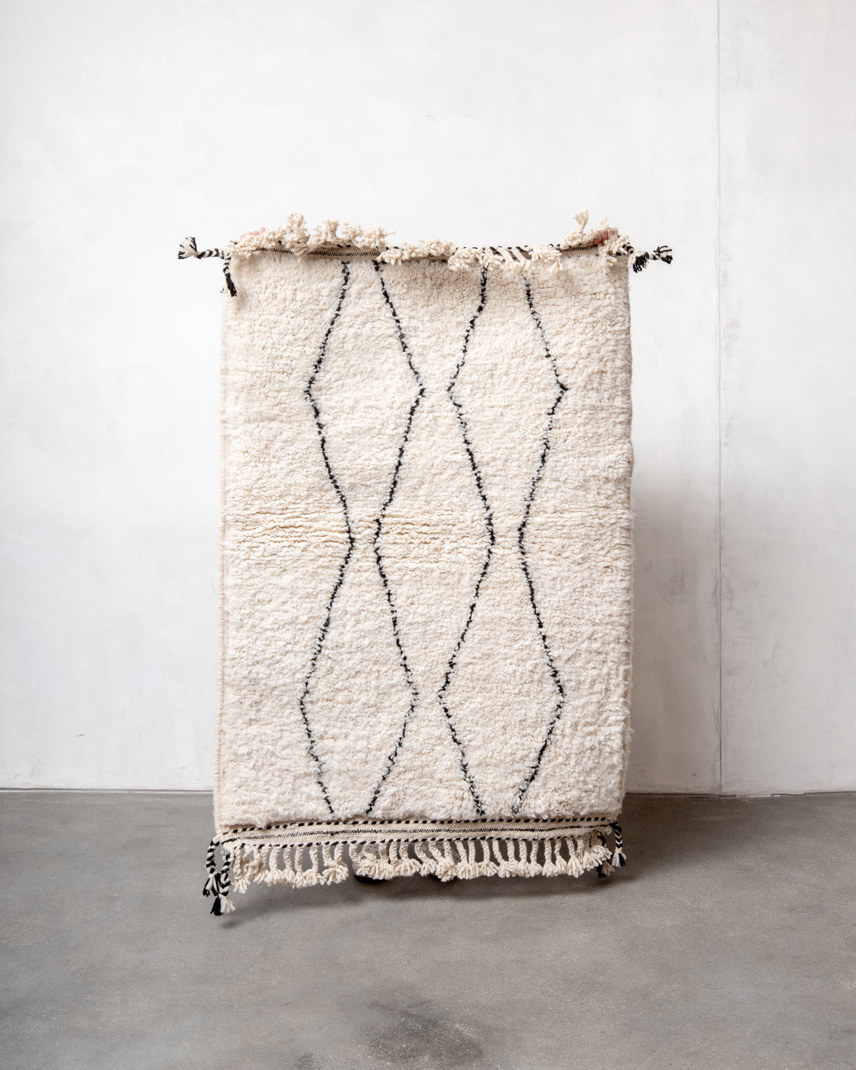 Modern, designer, handcrafted Berber rug from Morocco. Beniourain carpet with beautiful colours and patterns and fluffy wool texture.
